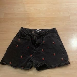 Black jean shorts with strawberries on it
